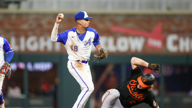 May 6, 2023; Atlanta, Georgia, USA; Atlanta Braves shortstop Vaughn Grissom (18) attempts to turn a double play over Baltimore Orioles third baseman Gunnar Henderson (2) in the sixth inning at Truist Park.